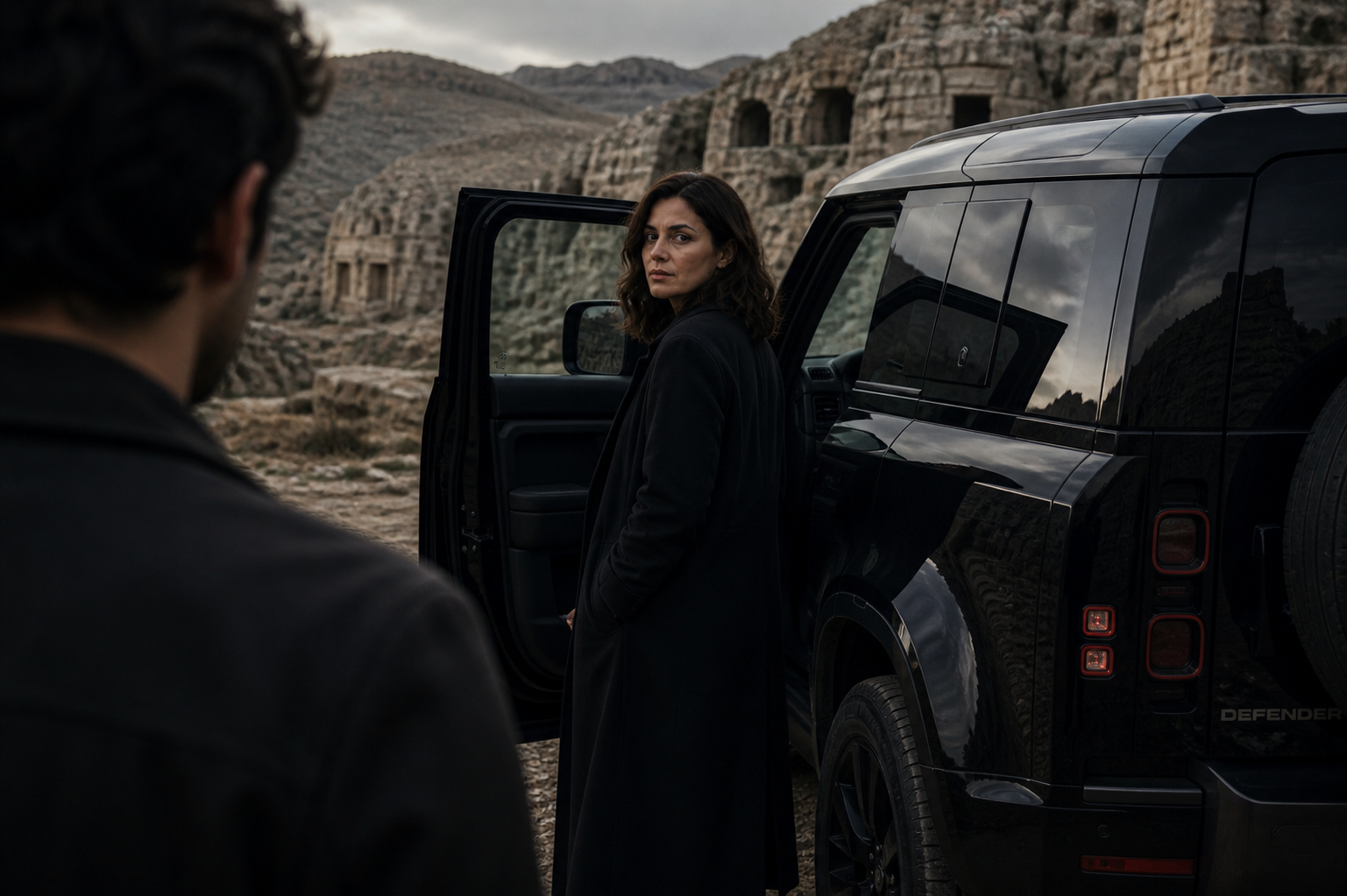 Cinematic campaign scene in a desert beside a black vehicle